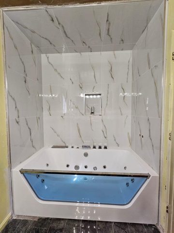 Jetted tub with a marble-look porcelain surround