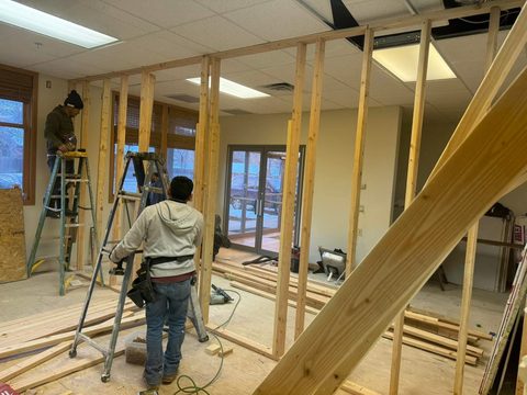 Crew framing offices in an open commercial space
