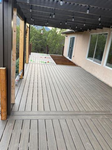 Composite deck walkway along the house