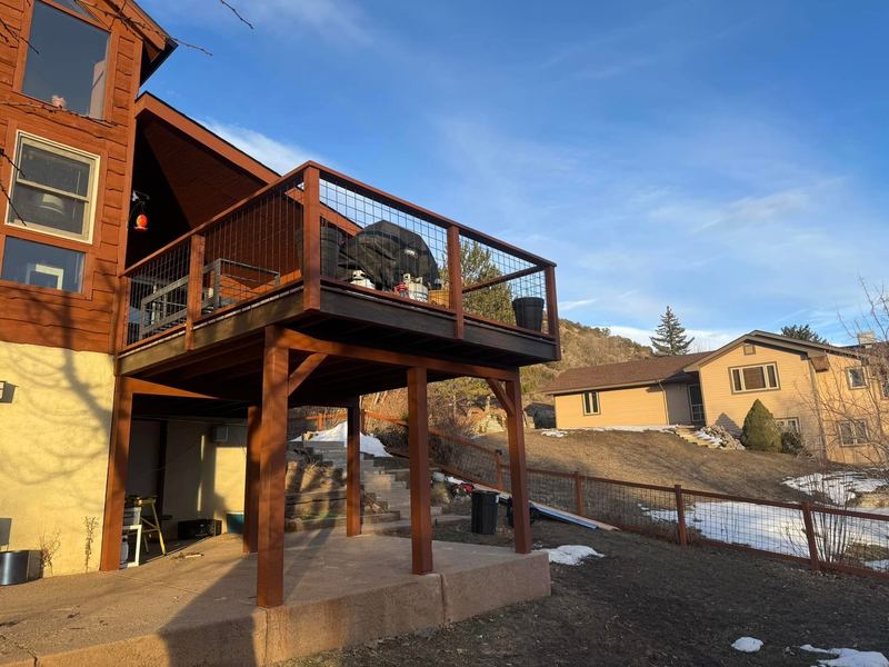 Elevated deck with cable railing and mountain views