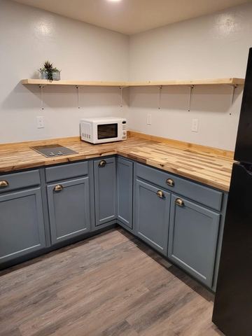 Butcher block counters and open shelving