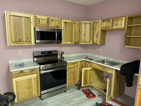 Office kitchenette with hickory cabinets