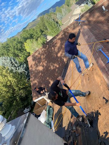 Crew re-decking a roof before underlayment